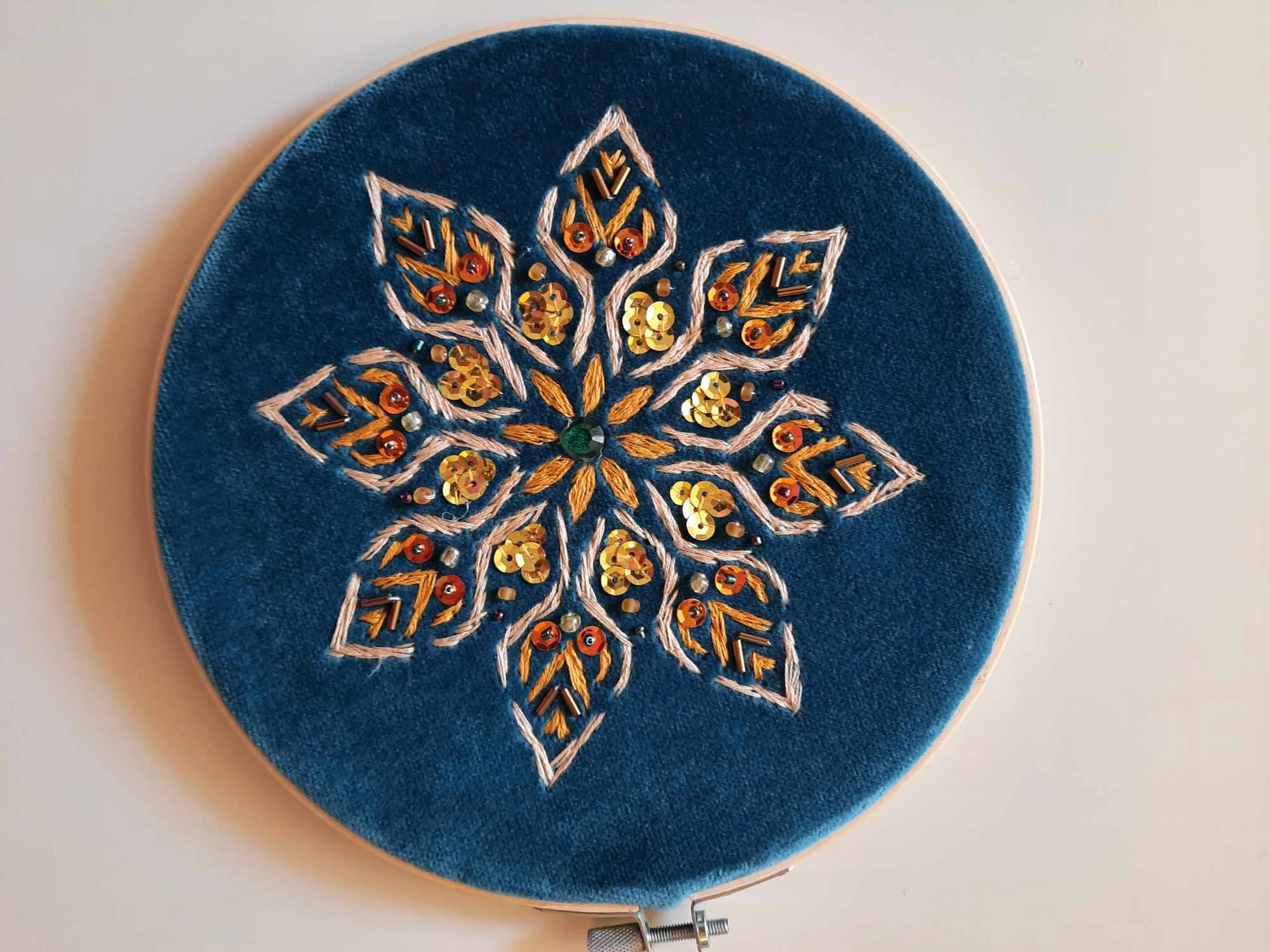 Gold embroidery and sequins on blue velvet